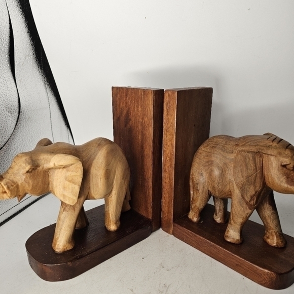 A pair of wooden‎ hand carved elephant bookends